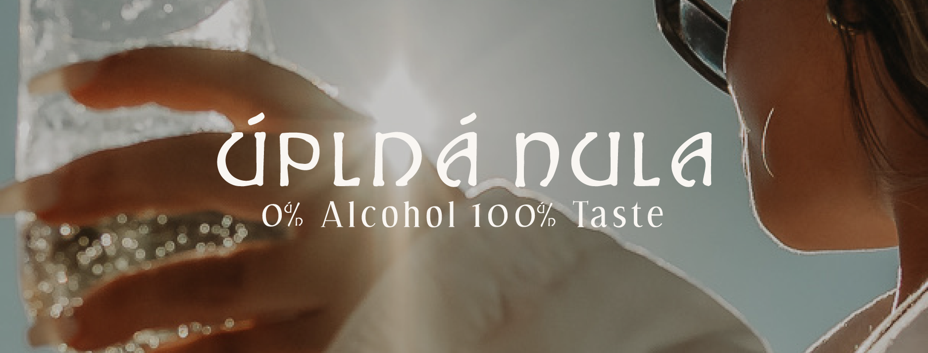 Úplná Nula brand hero with logo over a cinematic drinks photo.